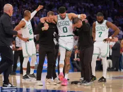Out of the hospital after surgery, Celtics star Jayson Tatum pays teammates a visit at team hotel in New York